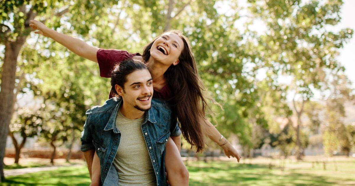 Service image with a man and woman feeling free and happy after getting anxiety treatment near Colorado Springs at The Mind Grove TMS Center.